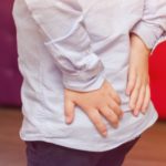 man suffering from pilonidal sinus