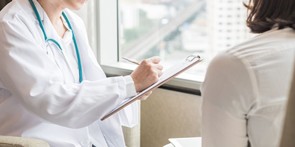 woman consulting a gynecologist