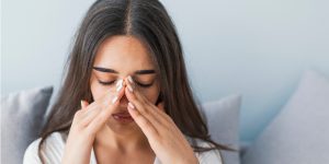 woman having pain due to sinus