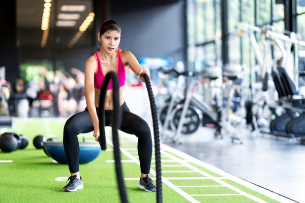 Girl exercising with ropes