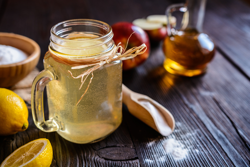 apple cider vinegar diluted in a cup 