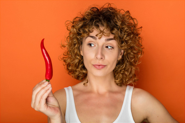 Lady holding red chilli