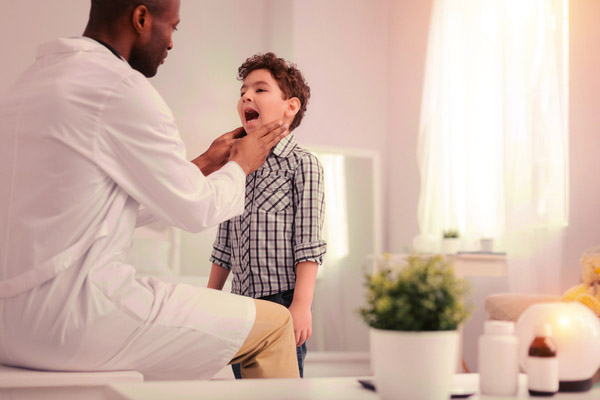 doctor checking inside the mouth