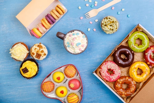 dairy foods and sweets on a blue background 