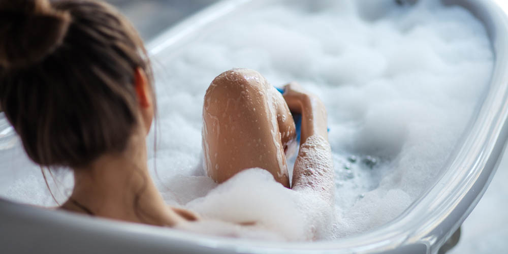 woman in bathtub-clean the vagina-maintain vaginal pH