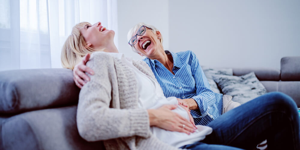 pregnant woman with an old woman