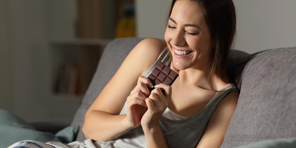 female eating chocolate
