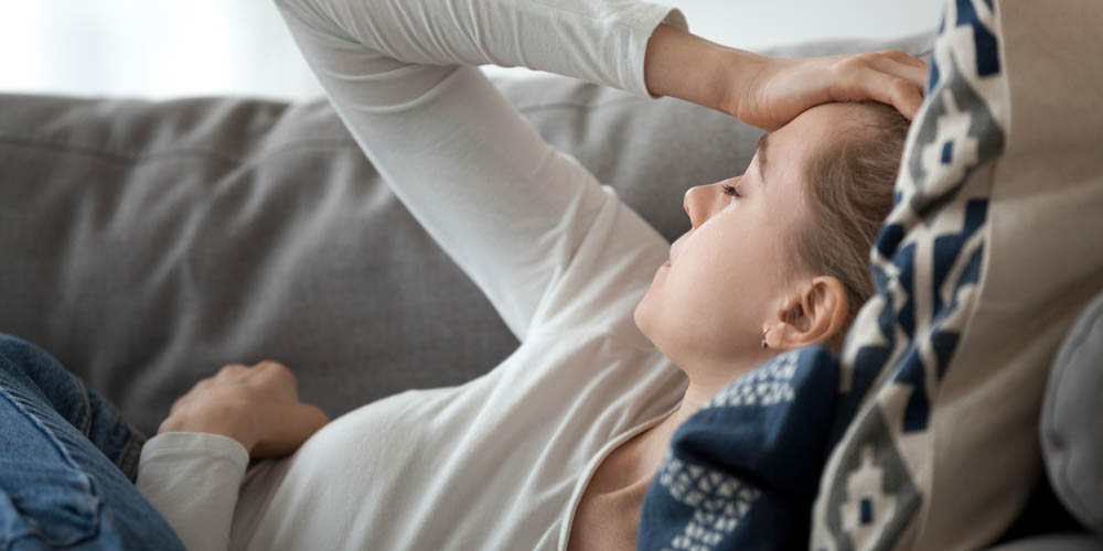 pregnant female having headache