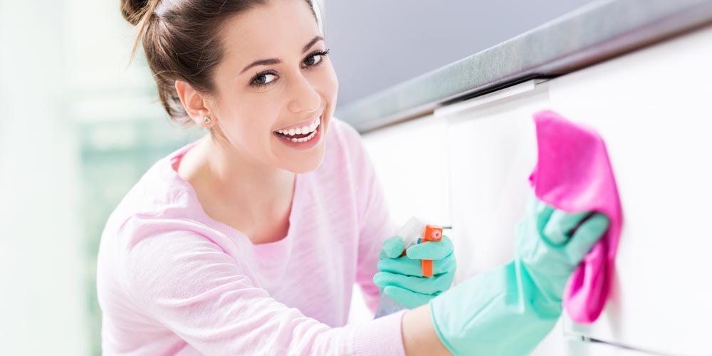 woman cleaning house with lemon peel extract