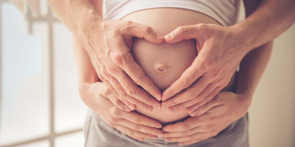 Pregnant women showing belly