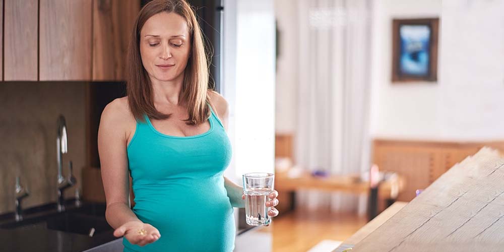 pregnant female holding Amoxicillin