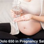 Pregnant Female holding Dolo 650 in her hand