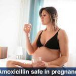 pregnant female holding Amoxicillin
