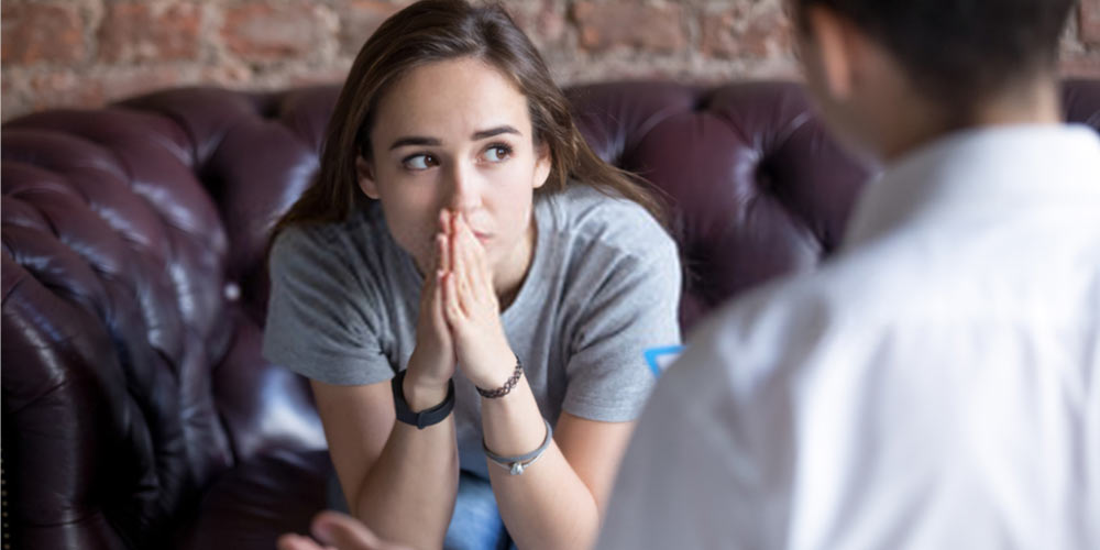 young female at doctor to confirm pregnancy