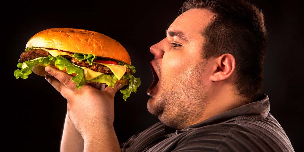 young man eating junk food