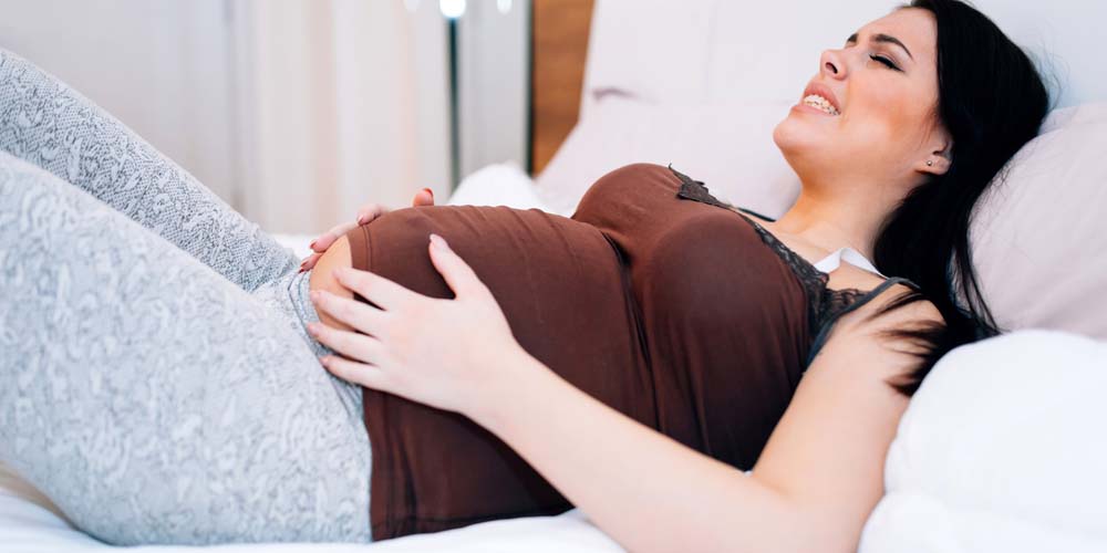 pregnant female sleeping on back 