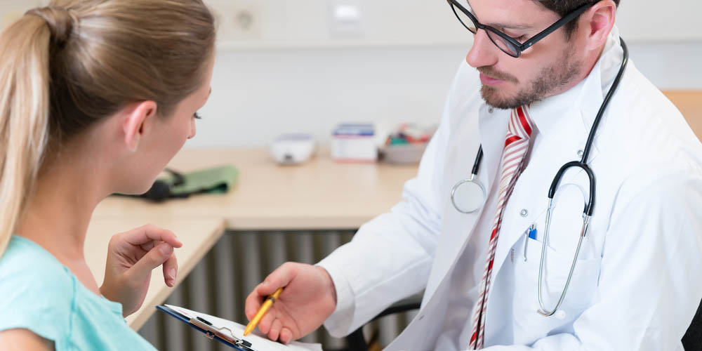 female at doctor for blood pregnancy test 