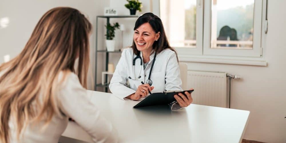 female at doctor for infertility treatment 