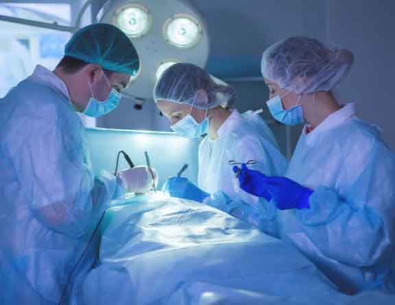 Doctors performing surgery to remove gallbladder stones