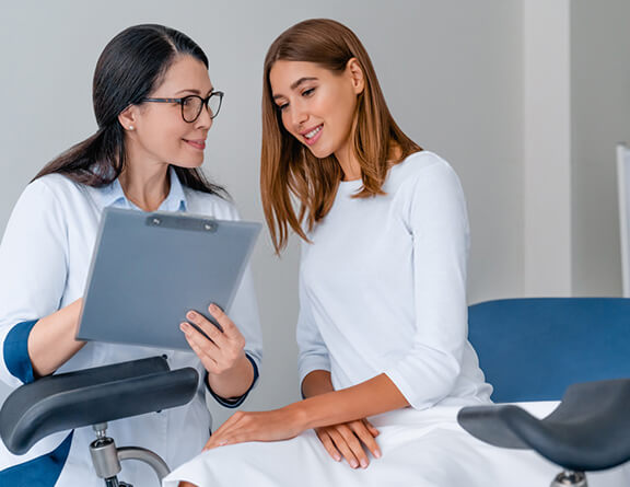 Female consulting gynecologist for treatment of pain during intercourse